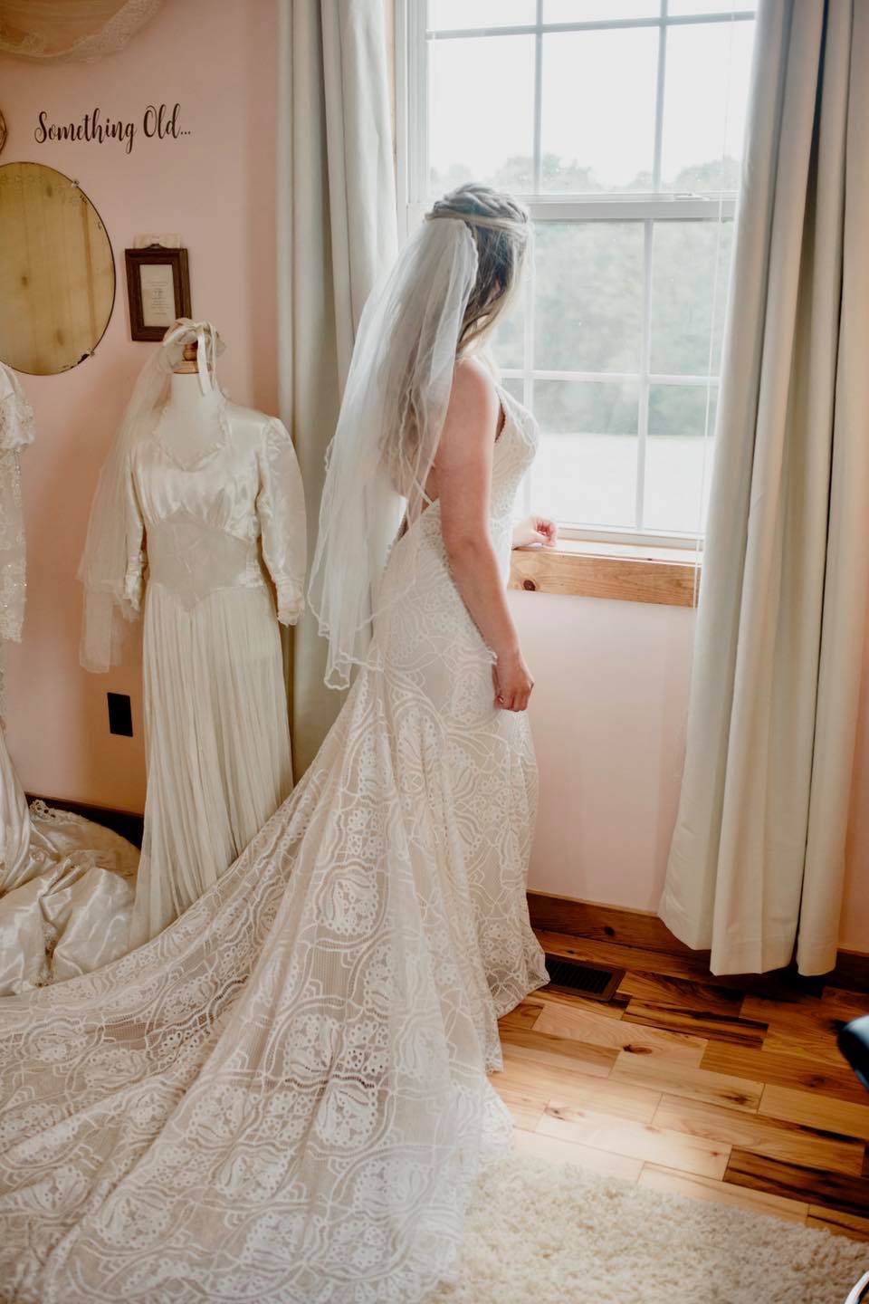 bride looking out window bridal cottage window