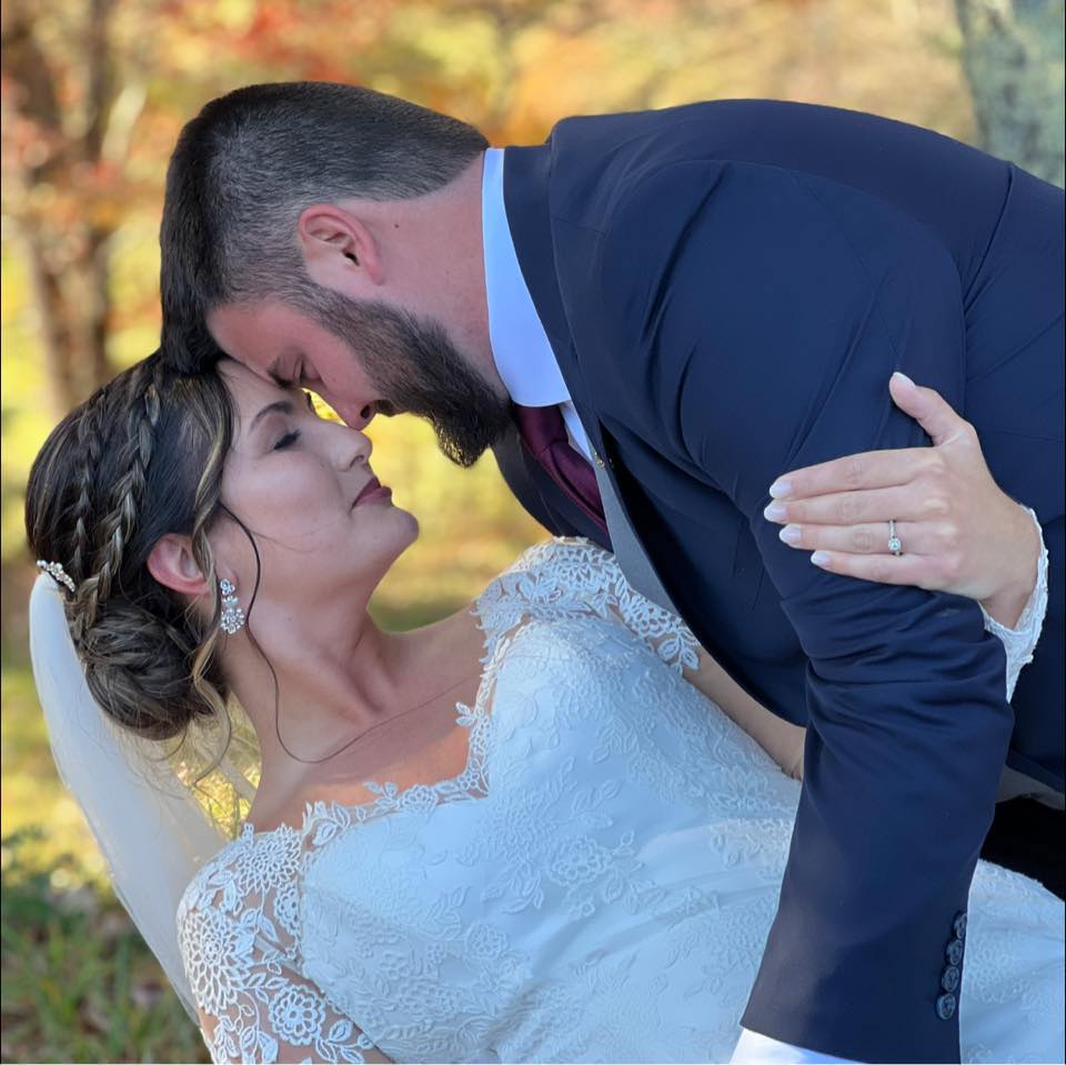 groom leaning against bride romantically